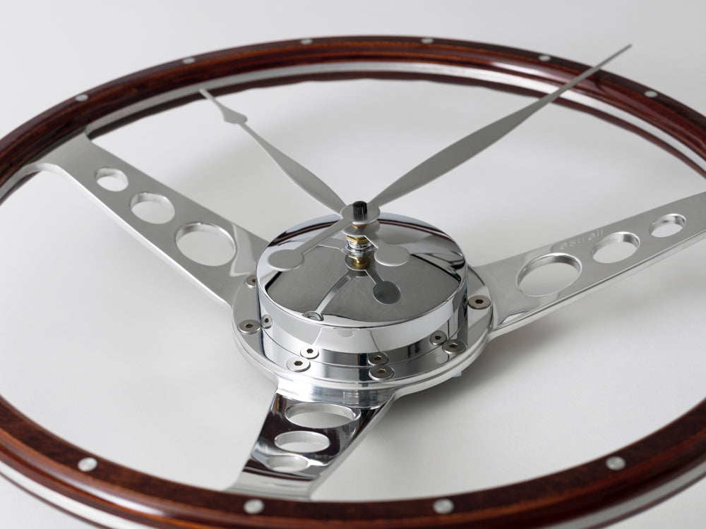 Classic car polished wooden steering wheel clock. Customers choice of car badge.