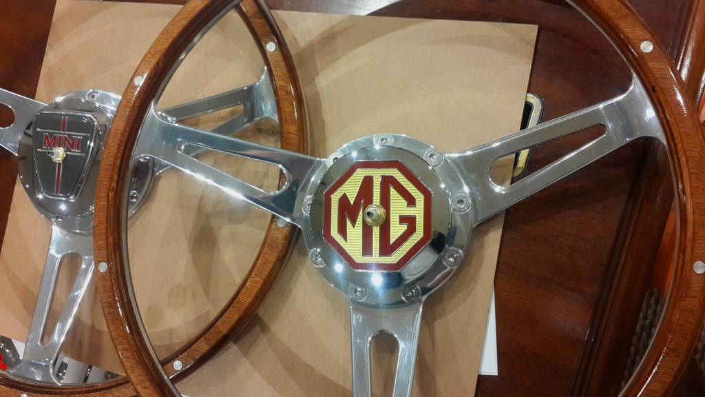 Classic car polished wooden steering wheel clock. Customers choice of car badge.